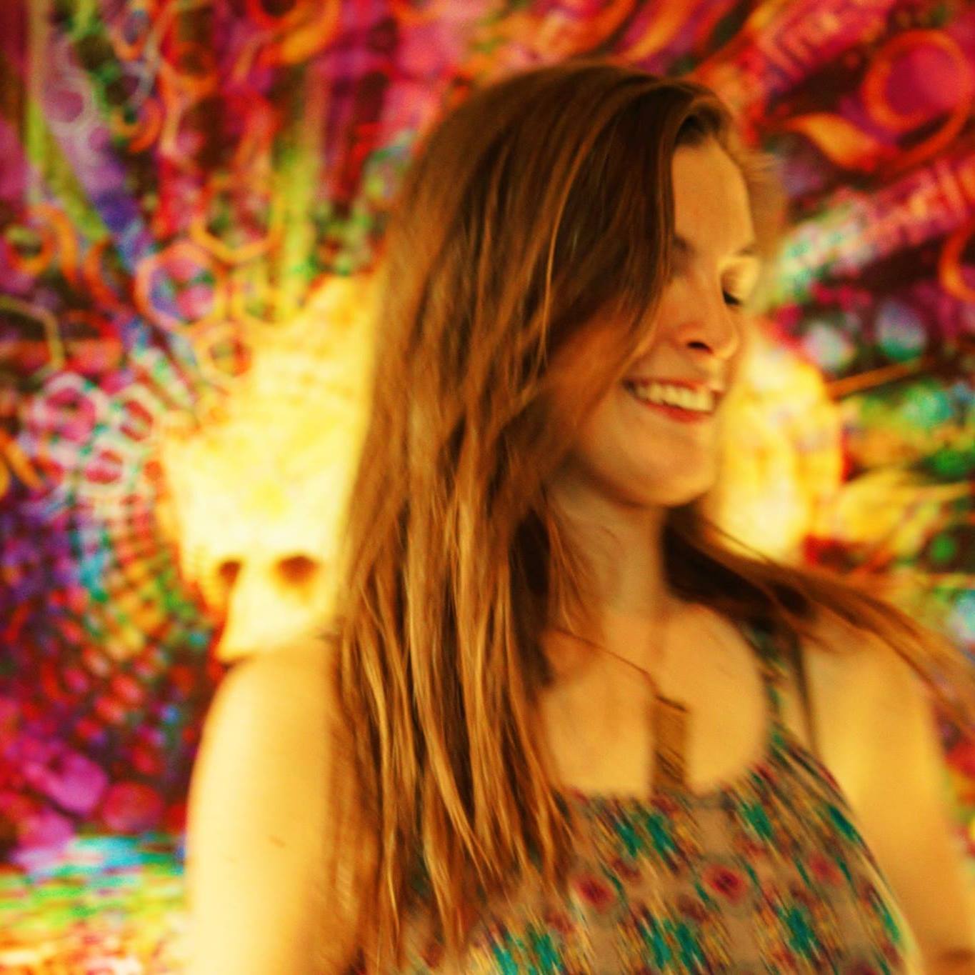 Image of Madeleine Elyea with a trippy-colorful background